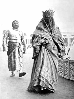 In the grandstand, before the arrival of Their Imperial Highnesses, Lilah meets for the first time the Begum of Bhopal, India's only female ruler. Prince Obaidulla, the Begum's son, walks behind his mother.